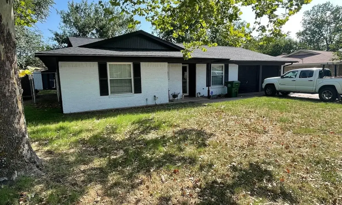 Professional roofing crew working on a residential roof in Fortuna Foothills